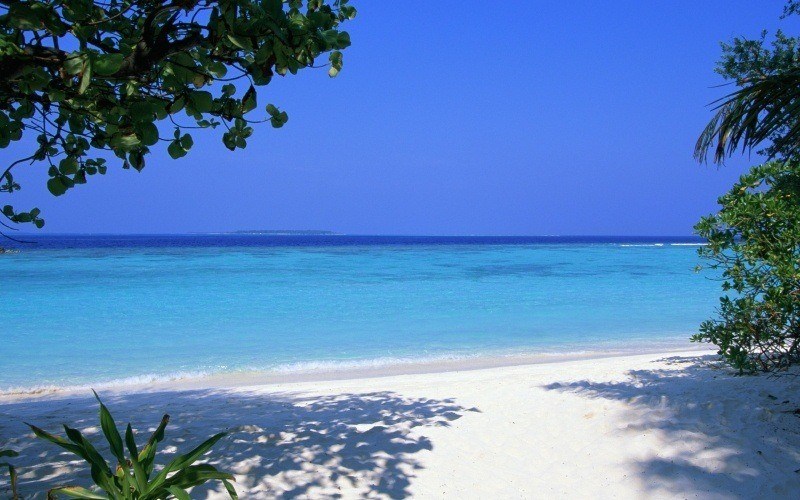 plage vacances sable ciel bleu
